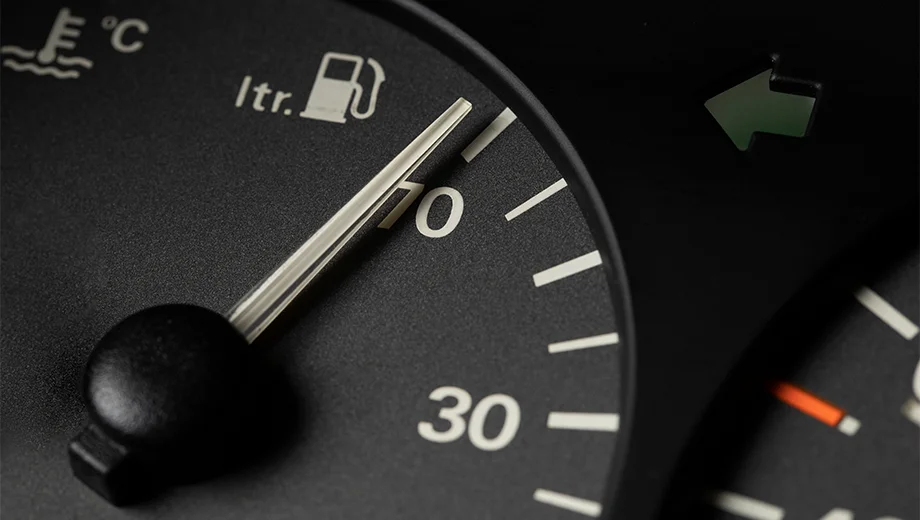 Image of a car dashboard with a fuel gauge indicating full tank, illustrating the concept of maximizing fuel efficiency.