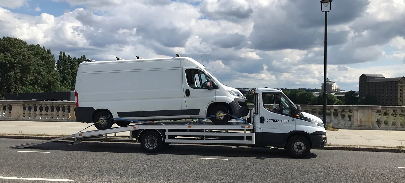 White tow truck with commercial van: London's best roadside assistance.