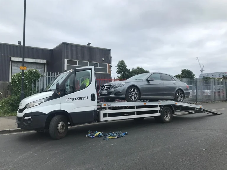 24/7 vehicle recovery in Harrow: Grey Mercedes sedan being loaded onto a Bodek Recovery truck.