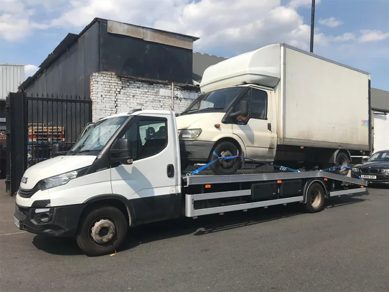 Large van recovery in Northolt: White truck towing a high-roof LWB box van.